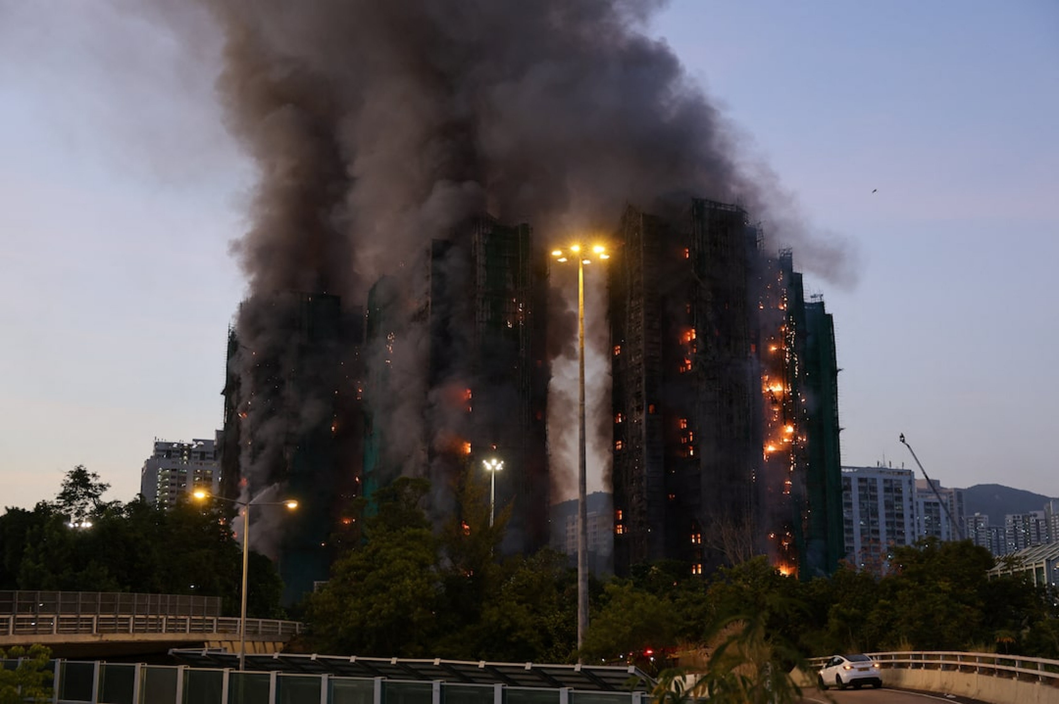 High-Rise Fire in Hong Kong Claims 14 Lives, Triggers Safety ...